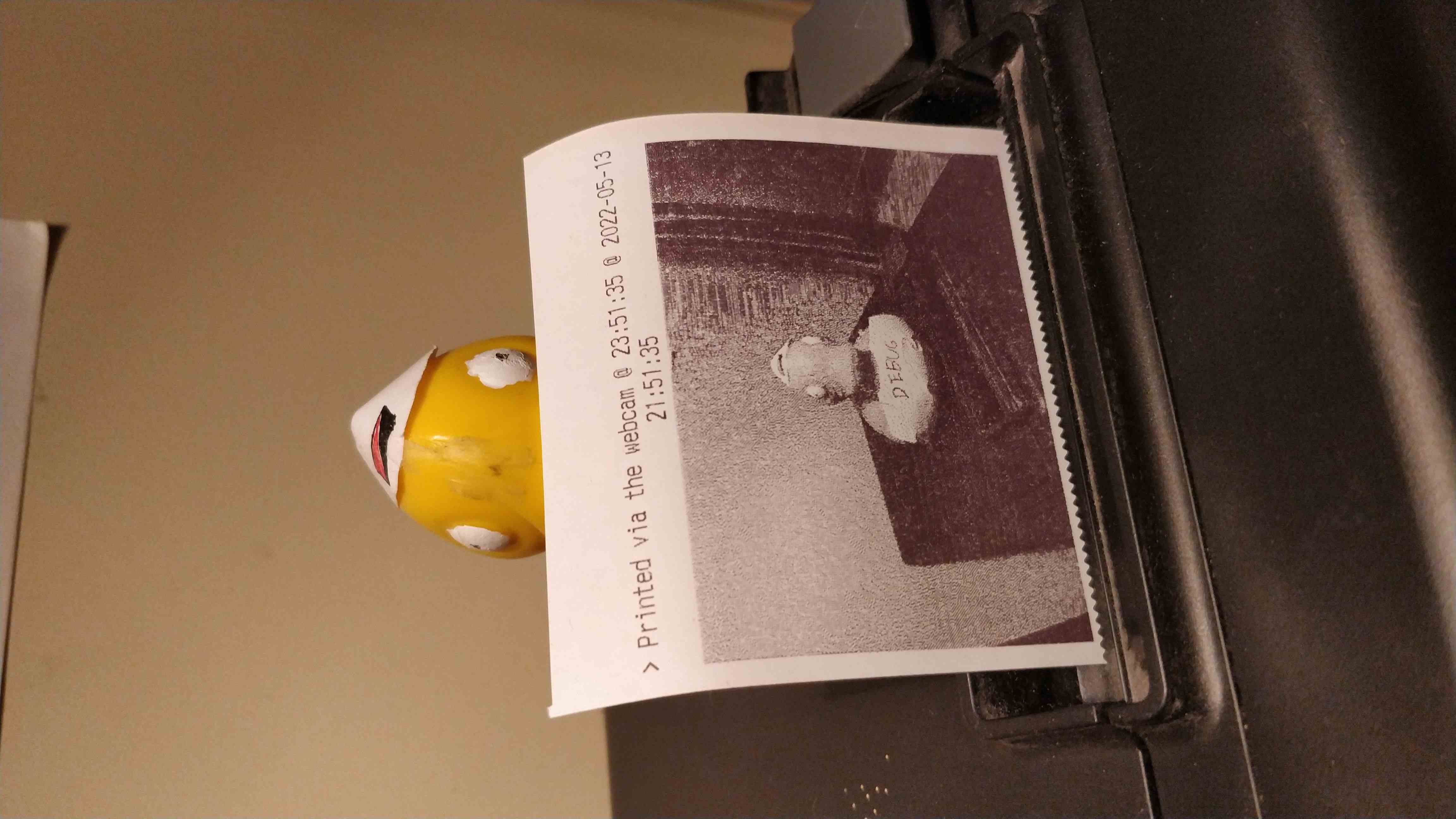 A picture of rubber duck on a thermal printer